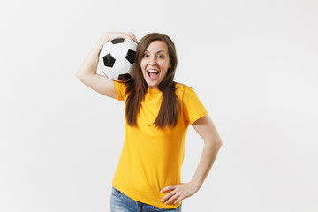 Wall Mural - Happy European young woman, football fan or player in yellow uniform holding soccer ball support favorite team isolated on white background. Sport, play football, cheer, fans people lifestyle concept.