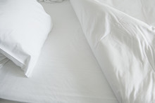 White Clean Sheets And Pillow Inviting To Go To Bed