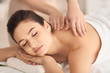© Pixel-Shot - Young woman receiving massage in spa salon