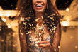 © Rido - Woman holding fire sparkler