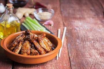 Wall Mural - Traditional Asian stir fry chicken wings with sesame and vegetables. Copy