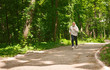 © Prostock-studio - Elderly man running in green forest, copy space