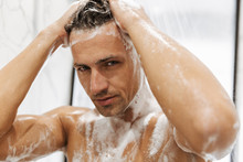 Close Up Of A Focused Man Having A Shower