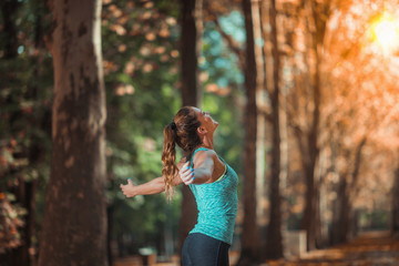 Wall Mural - Woman Exercising Outdoors in The Fall