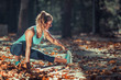 © Microgen - Woman Exercising Outdoors in The Fall