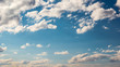 Blue sky with white clouds background. Beautiful cloudscape in summer day