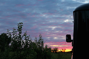 Evening, summer nature, while traveling on a high-terrain vehicle, over hilly terrain and inland roads.