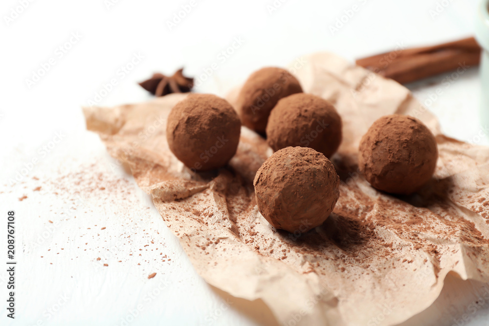 Tasty chocolate truffles on white table, closeup