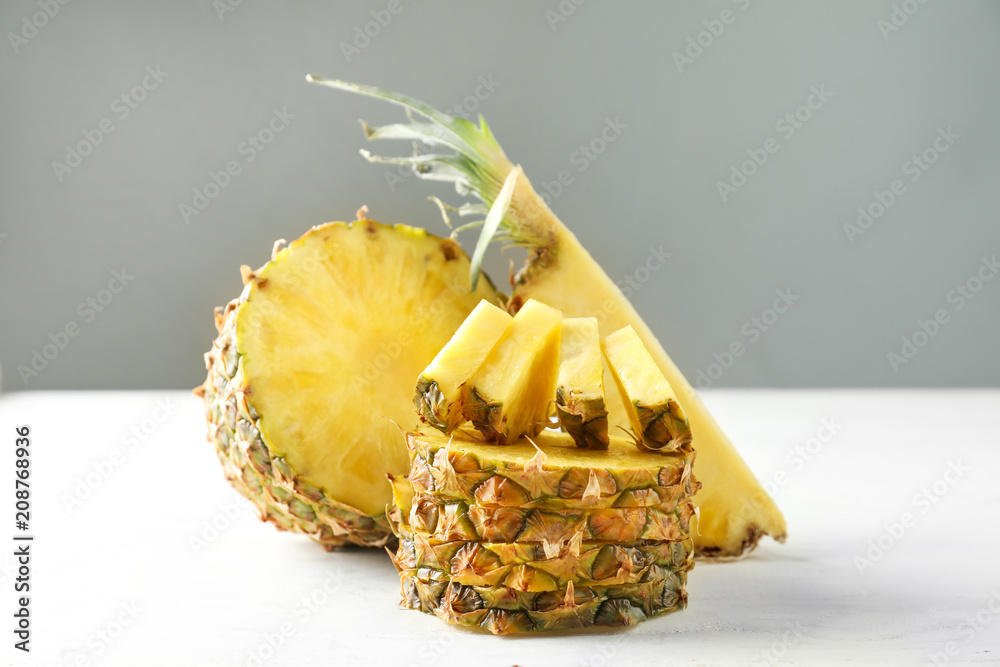 Delicious sliced pineapple on white table