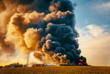Building Fire Among Fields And Huge Smoke Cloud