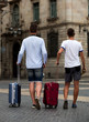 © JackF - Rear view of two guys with luggage