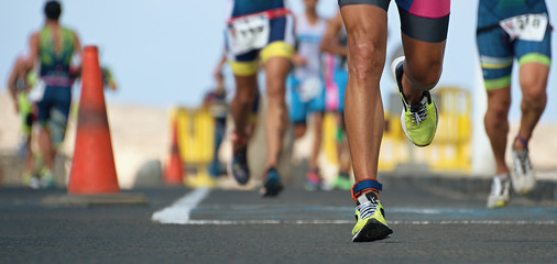 Wall Mural - Marathon running race, runners feet on road