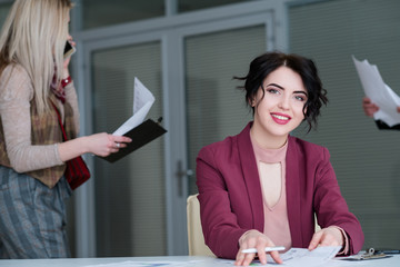 Wall Mural - young beautiful smiling business woman. successful stylish company manager in office workspace