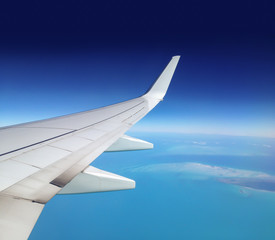 Looking out the airplane window.