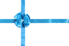 Blue Gift Satin Bow And Ribbon In Polka Dots Isolated On White Background