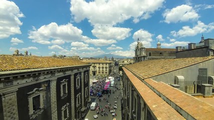 Wall Mural - Aerial skyline view of Catania old town, Sicily, Italy. View to Piazza del Duomo and Via Etnea street. Mount Etna on the background. Time Lapse. 4K UltraHD