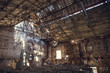 Ruins of abandoned old broken industrial factory or warehouse buildings after disaster, war or cataclysm