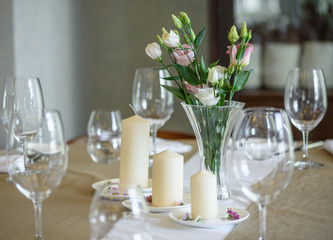 Beautiful flowers in vase with light from window