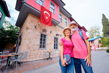 Travel and tourism. Senior family couple walking together on Turkey's street.