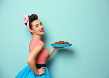 Funny Young Housewife With Homemade Pastry On Color Background