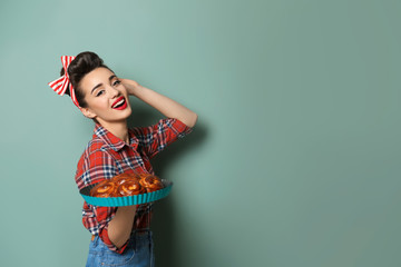 Poster - Funny young housewife with homemade pastry on color background