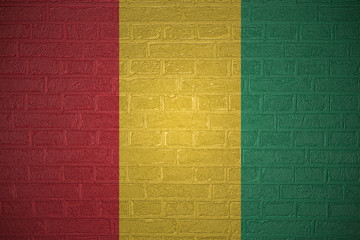 Flag of Guinea on brick wall, 3d illustration