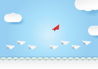 Wall Mural - business teamwork and leadership concept with red paper plane change direction from the white group.