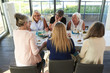 © Jeff Wasserman/Stocksy - Senior Women Friends Enjoying Wine and Company
