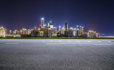 Wall Mural - Panoramic skyline and buildings with empty road，chongqing city at night