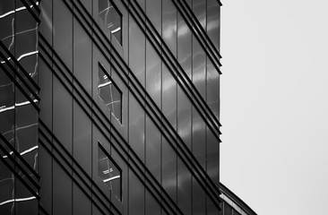 windows of commercial building in Hong Kong with B&W color