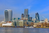 Fototapeta Londyn - The City of London skyline, including 20 Fenchurch Street, the Leadenhall Building and 30 St Mary Axe with blue winter sky.