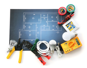 Wall Mural - Electrician's supplies with electrical scheme on white background