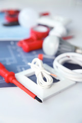 Wall Mural - Electrician's supplies on white background, closeup