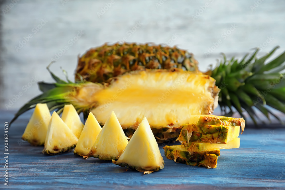 Sliced fresh pineapple on wooden table