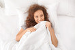 © Pixel-Shot - Morning of young African-American woman in bed