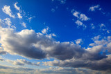 Fototapeta Niebo - Clouds on a blue sky as a background