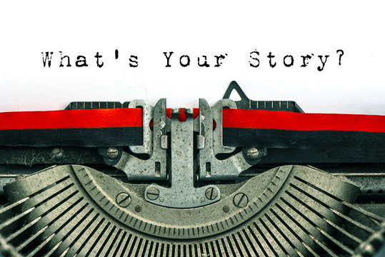 Antique typewriter text What’s Your Story white paper background