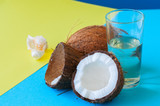 Fototapeta Sport - Whole coconuts and coconut water . Doutone background.
