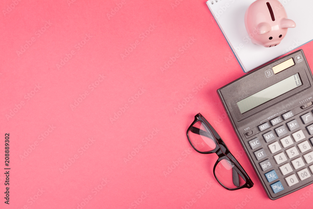 Piggy bank and calculator on color background, top view. - obrazy, fototapety, plakaty 