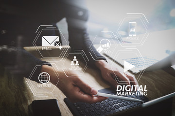 Poster - Website designer working digital tablet dock keyboard and computer laptop with smart phone and graphics design diagram on mable desk as concept