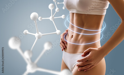 Cuadros en Lienzo Woman with perfect body near big molecule chain.
