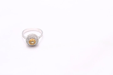 Yellow gem stone and diamond ring