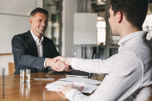 Cuadros en Lienzo Business, career and placement concept - successful young man smiling, and hands