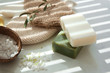 Bars of natural soap with olive extract and sea salt on table