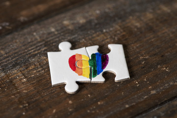 Sticker - puzzle pieces forming a rainbow heart