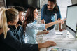 © NDABCREATIVITY - Young architects working on project in office