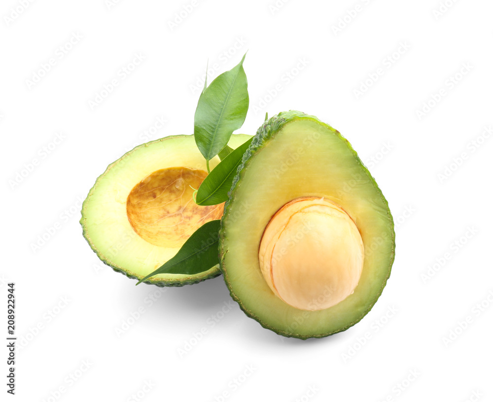 Halves of ripe avocado on white background