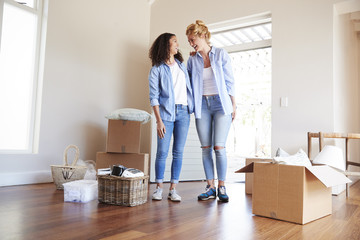 Sticker - Female Friends Standing In Lounge Of New Home On Moving Day