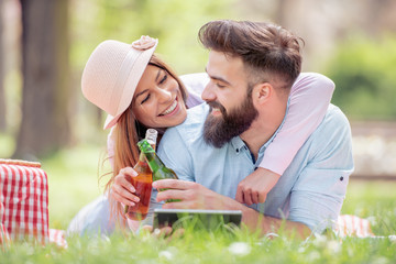 Sticker - Beautiful young couple at a picnic in the park