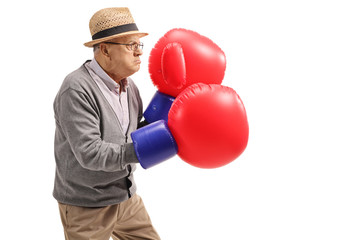 Poster - Mature man wearing a pair of big boxing gloves